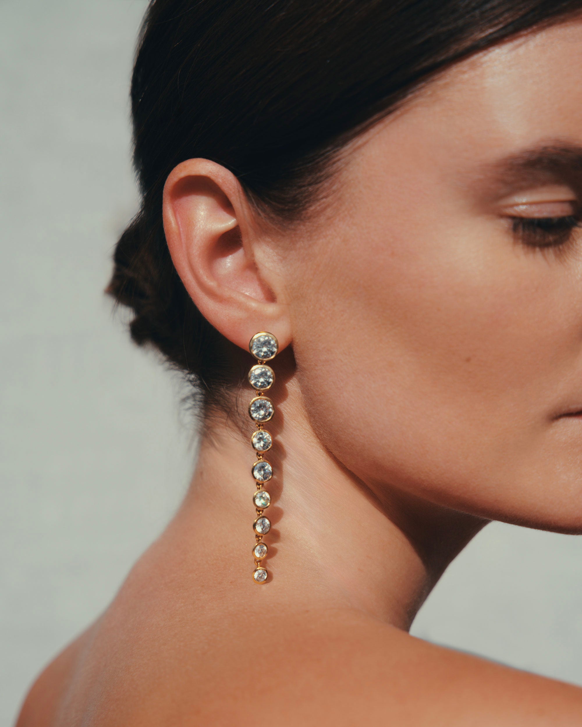 Daphine Cleo earrings in gold and zirconia stones