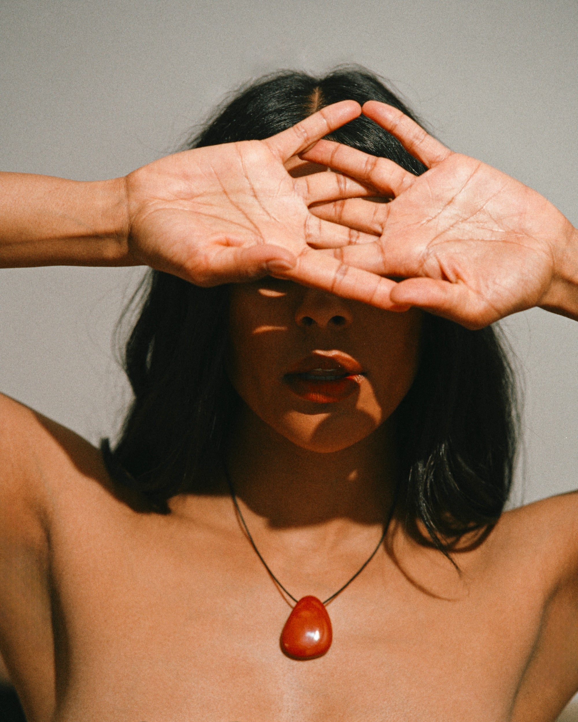 Monikh Dale x Daphine, Swin Jasper stone pendant necklace and Reena rings in gold.